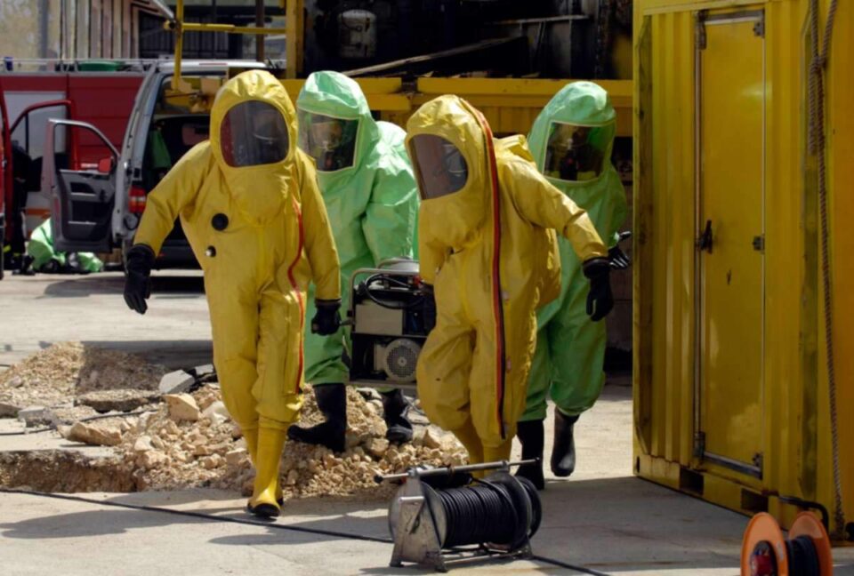 Team carrying hazardous waste in Fayetteville, NC