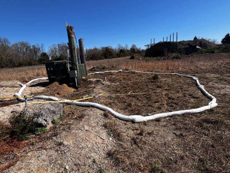 Land contamination investigation area with marked soil testing perimeter in Raleigh, NC